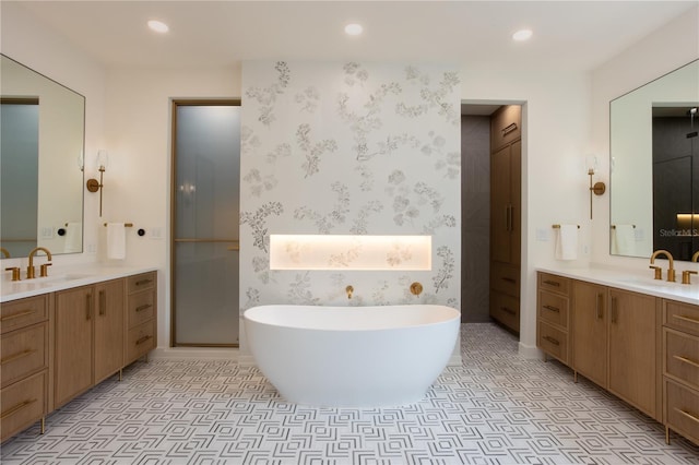 bathroom featuring tile patterned floors, a sink, and recessed lighting