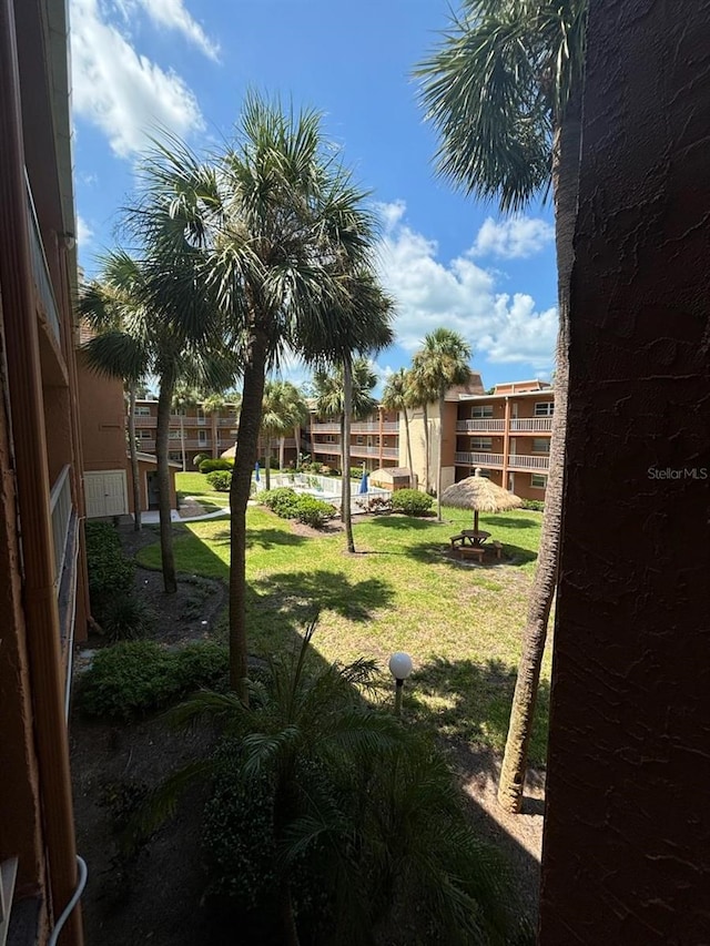 view of yard with a balcony