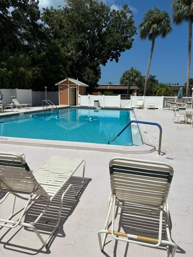 view of pool featuring a patio