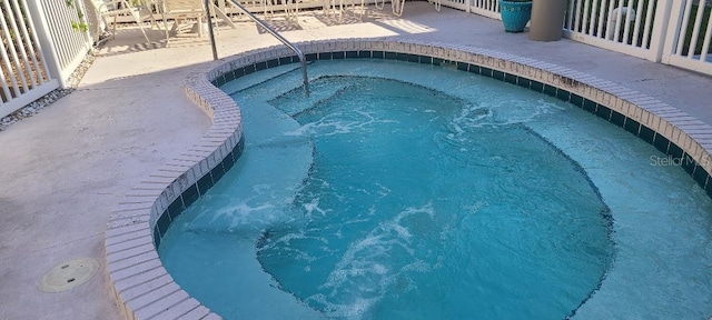 view of swimming pool featuring a patio area