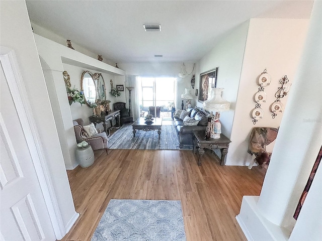 living room with light hardwood / wood-style floors