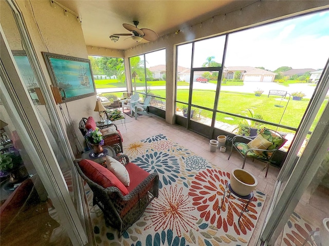 sunroom / solarium with ceiling fan