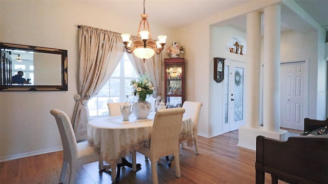 dining room with a notable chandelier and hardwood / wood-style floors