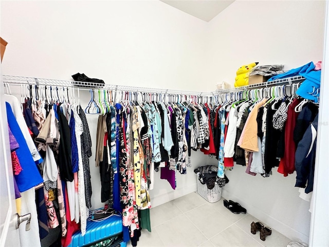 walk in closet featuring tile patterned flooring