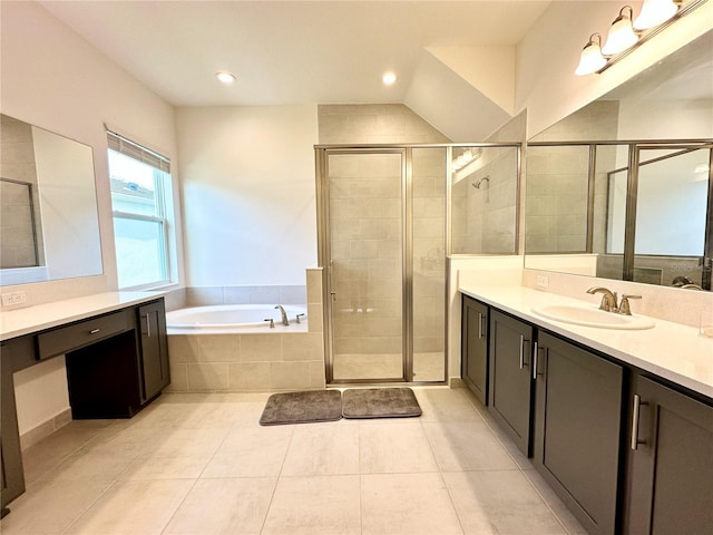 bathroom featuring recessed lighting, vanity, a bath, tile patterned floors, and a stall shower