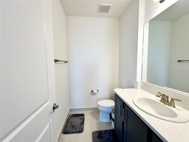 half bath with baseboards, visible vents, toilet, tile patterned floors, and vanity