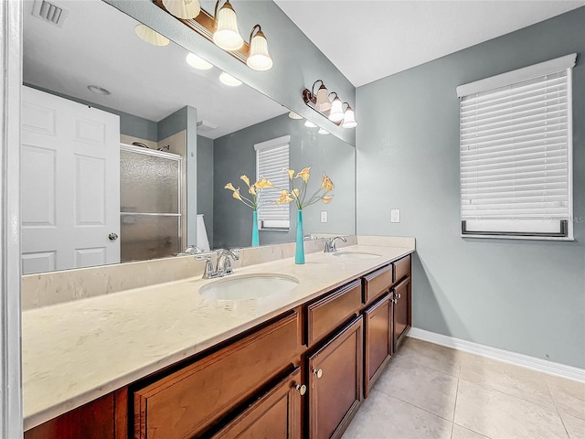 bathroom featuring tile patterned flooring and dual vanity