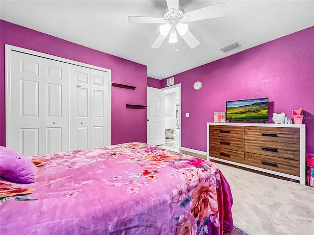 bedroom featuring ceiling fan, a closet, and carpet