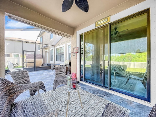 balcony featuring ceiling fan and a patio