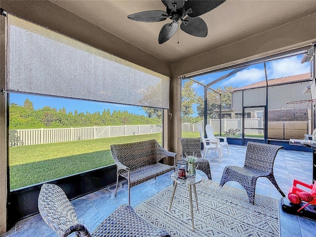 sunroom with ceiling fan