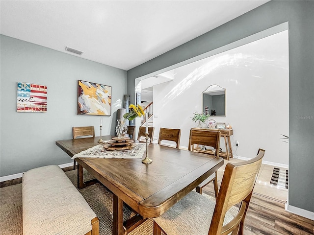 dining space featuring hardwood / wood-style floors