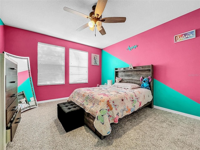 bedroom featuring ceiling fan and carpet