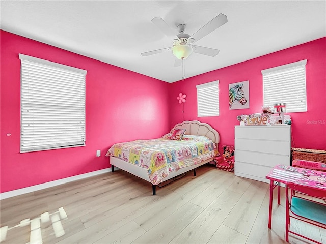 bedroom featuring ceiling fan and light hardwood / wood-style floors