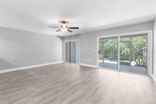 unfurnished room with a textured ceiling, ceiling fan, and hardwood / wood-style flooring