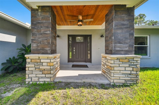 entrance to property with ceiling fan