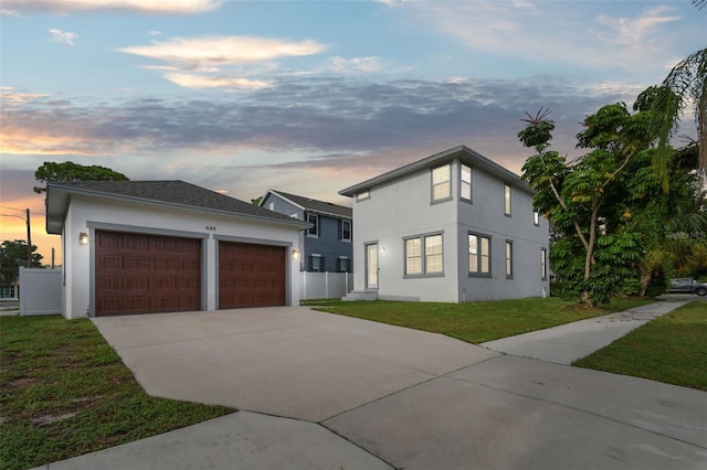 view of front of house with a lawn and a garage