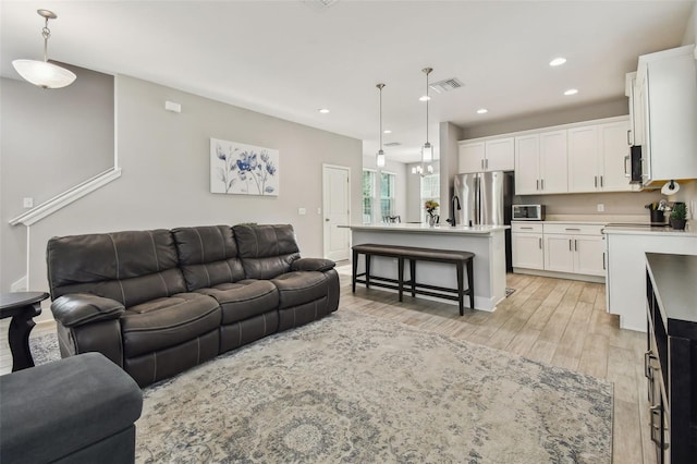 living room featuring light wood-type flooring