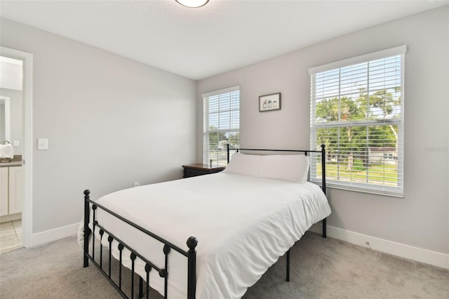 bedroom with light colored carpet