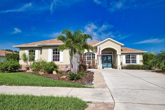 view of front of house featuring french doors and stucco siding