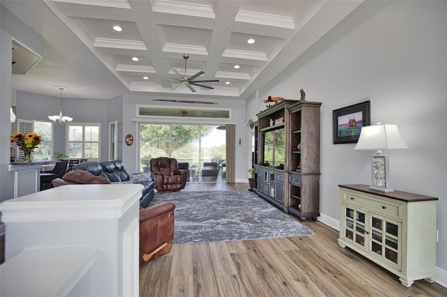 living room with recessed lighting, coffered ceiling, wood finished floors, and a healthy amount of sunlight