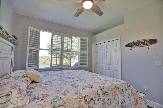 bedroom with a ceiling fan, a closet, and vaulted ceiling