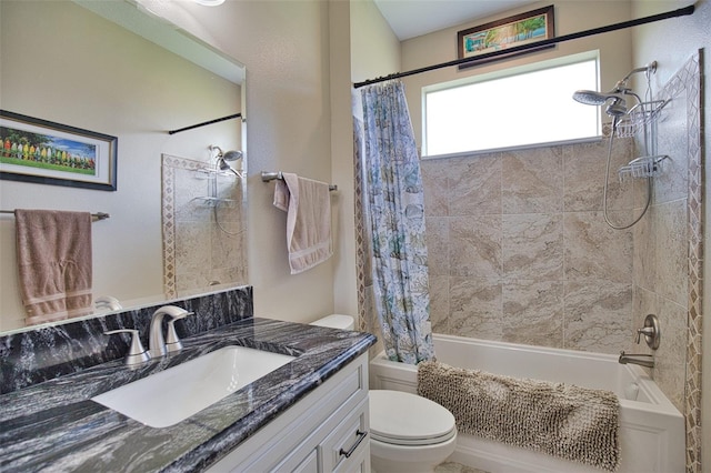 bathroom with shower / bathtub combination with curtain, toilet, and vanity