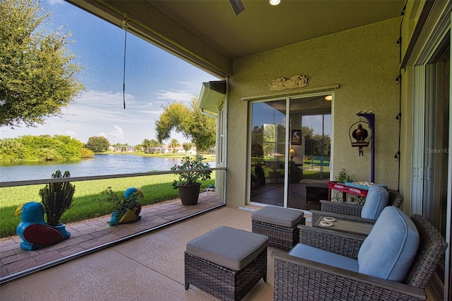 sunroom / solarium with a water view and a wealth of natural light