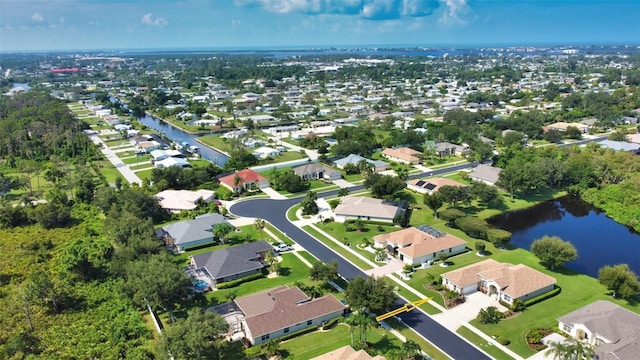 bird's eye view with a residential view and a water view