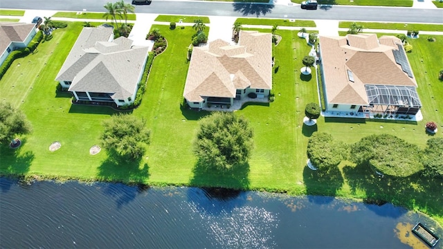 bird's eye view with a water view and a residential view