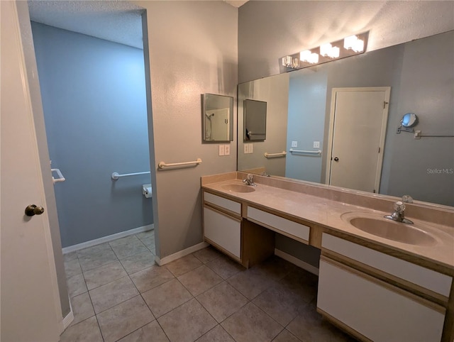 bathroom with tile patterned flooring and vanity