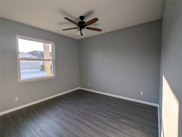 unfurnished room featuring dark hardwood / wood-style flooring and ceiling fan