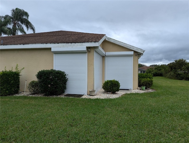 view of side of property featuring a yard