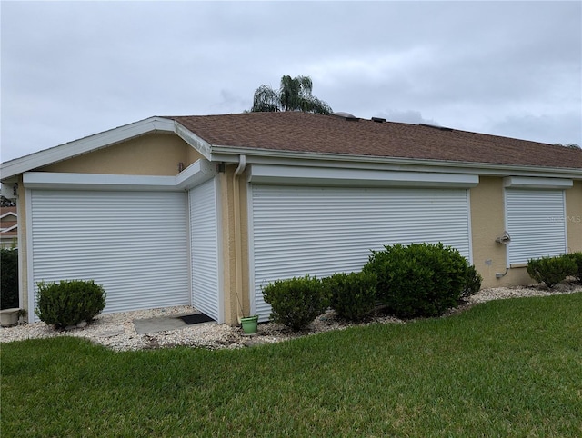 view of side of home featuring a lawn