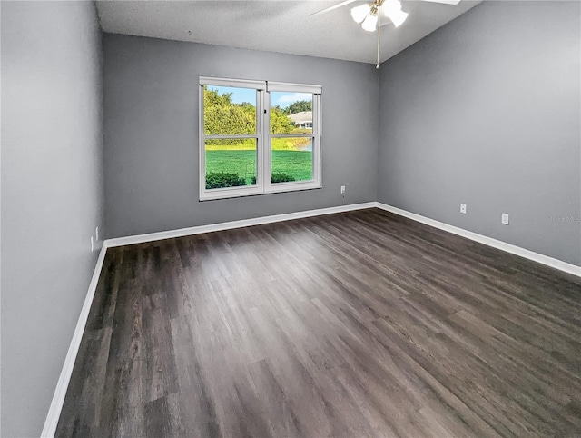 unfurnished room with a textured ceiling, dark hardwood / wood-style flooring, and ceiling fan