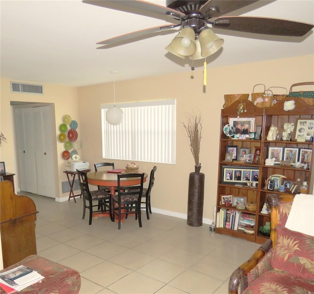 dining room with ceiling fan and light tile patterned flooring