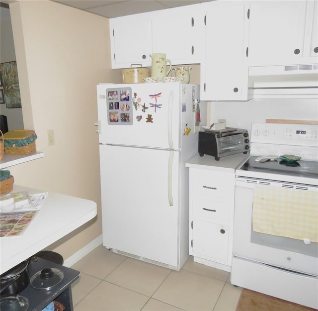 kitchen with custom range hood, white appliances, white cabinetry, and light tile patterned floors