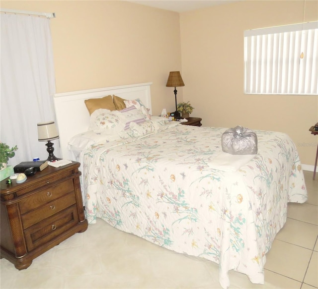 bedroom featuring light tile patterned flooring