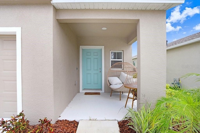 doorway to property featuring a garage