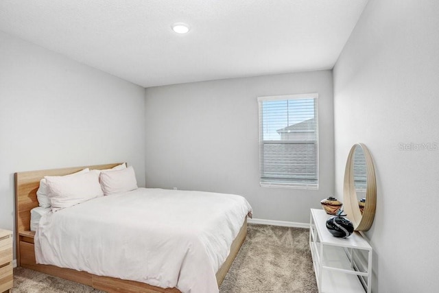 bedroom featuring light colored carpet