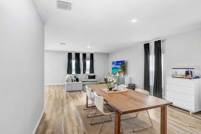 dining space featuring light hardwood / wood-style flooring