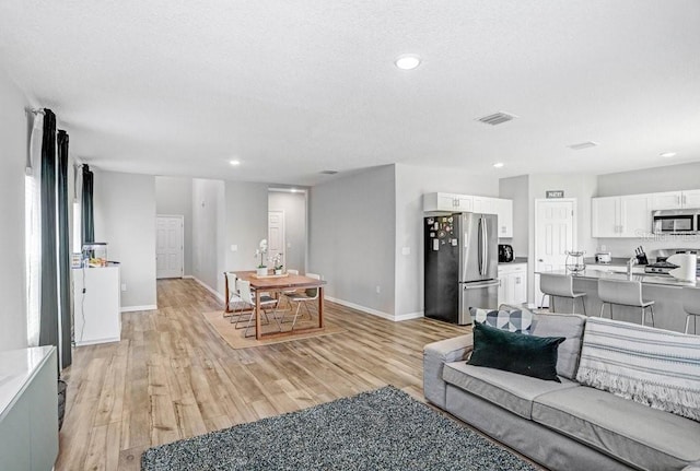 living room featuring light hardwood / wood-style floors