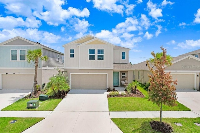 view of front of property featuring a front yard and a garage