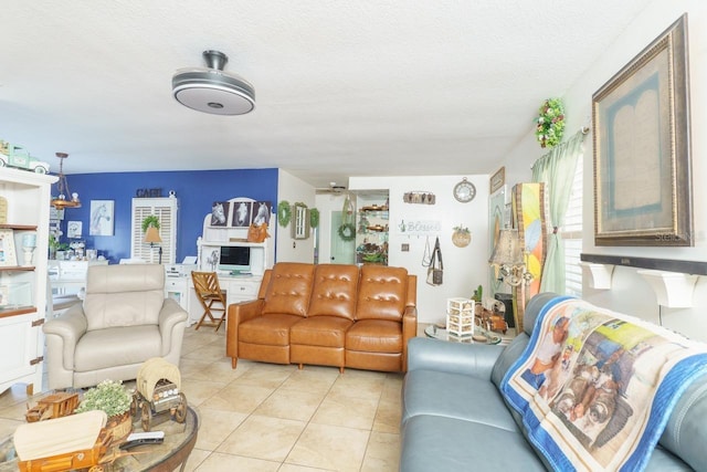 living room with light tile patterned floors and a textured ceiling