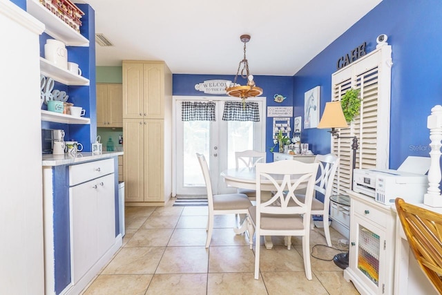 dining space with light tile patterned floors