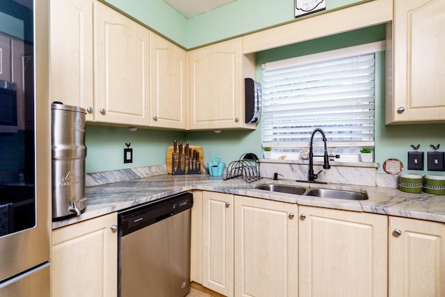 kitchen featuring a sink, light countertops, and dishwasher