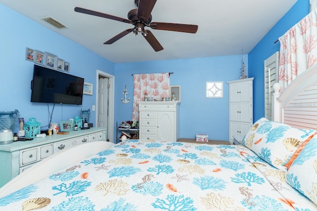 bedroom featuring visible vents and ceiling fan