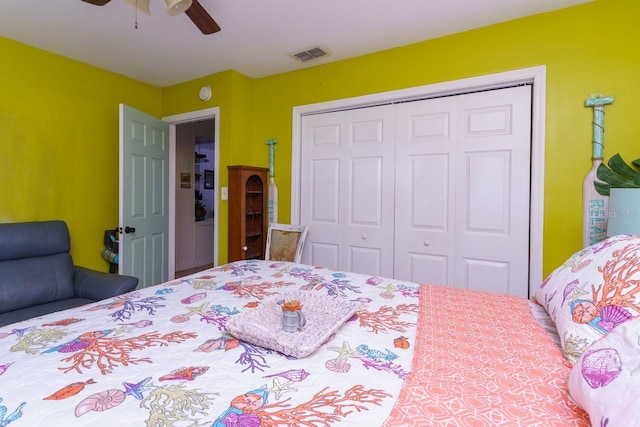 bedroom featuring ceiling fan, a closet, and visible vents