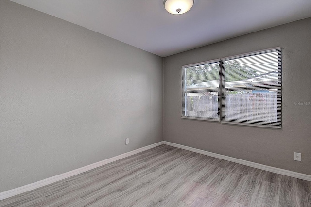 empty room with light wood-type flooring