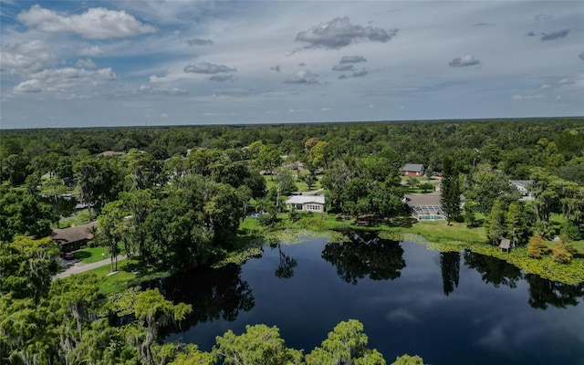 aerial view with a forest view and a water view