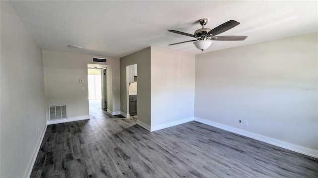 empty room featuring ceiling fan and hardwood / wood-style flooring